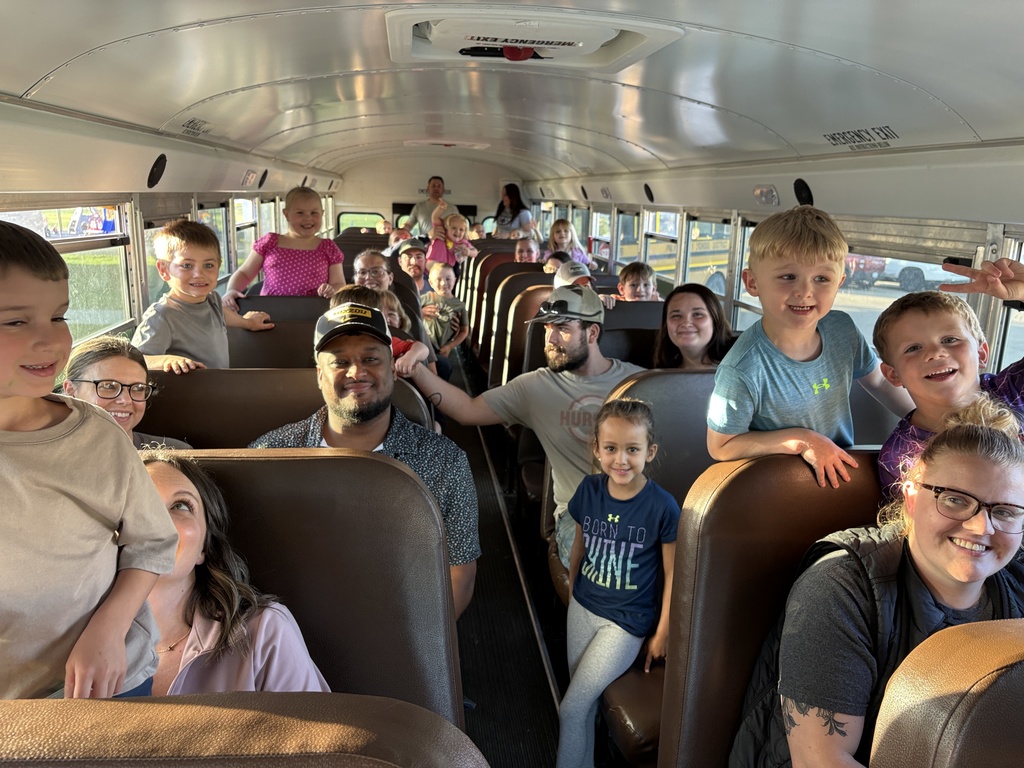 Parents and students ride bus during Kindergarten prep night