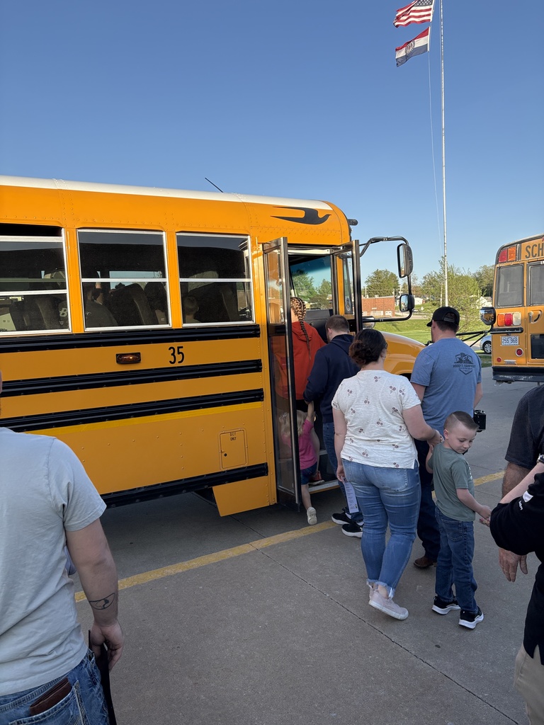 Parents and students ride bus during Kindergarten prep night