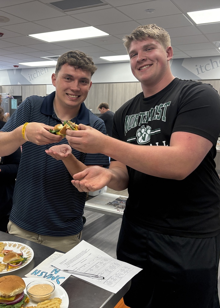 Judge and student tasting their burger and fries in Foods class
