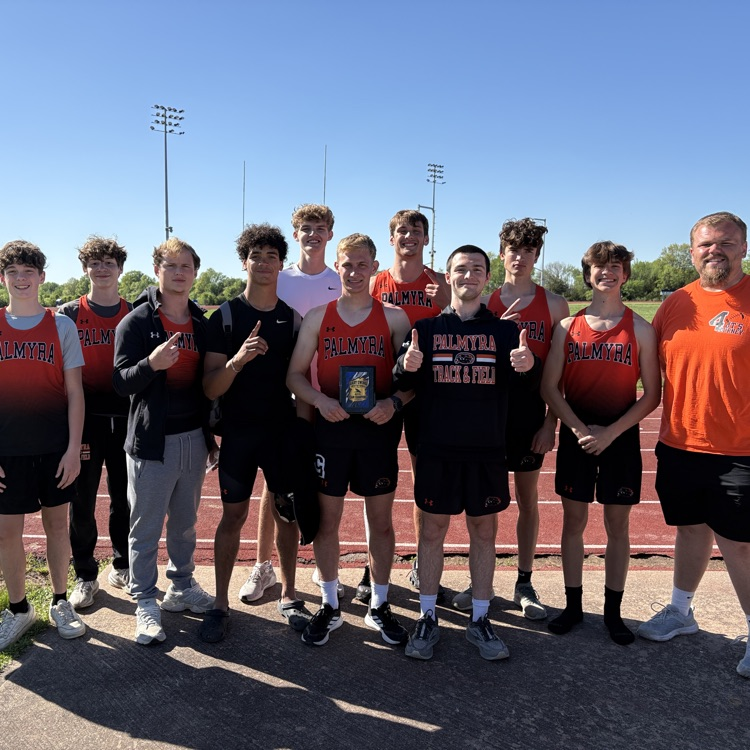 boys track team with plaque 
