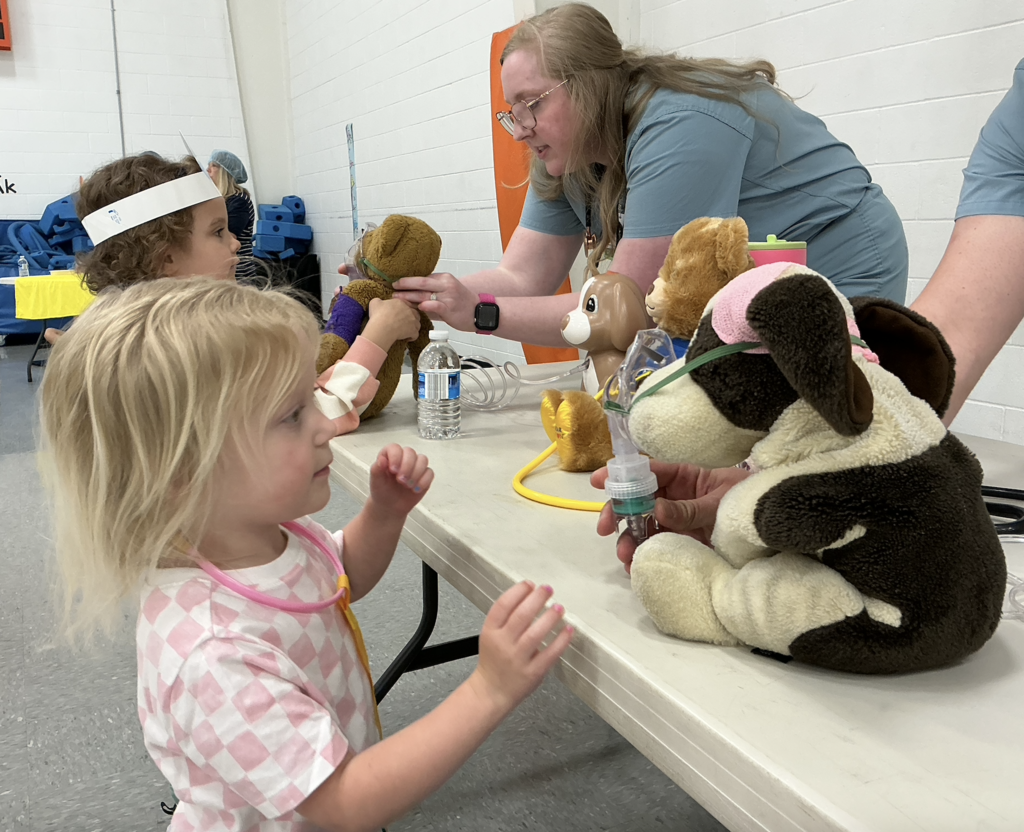 Students participating in PAT Teddy Bear Clinic