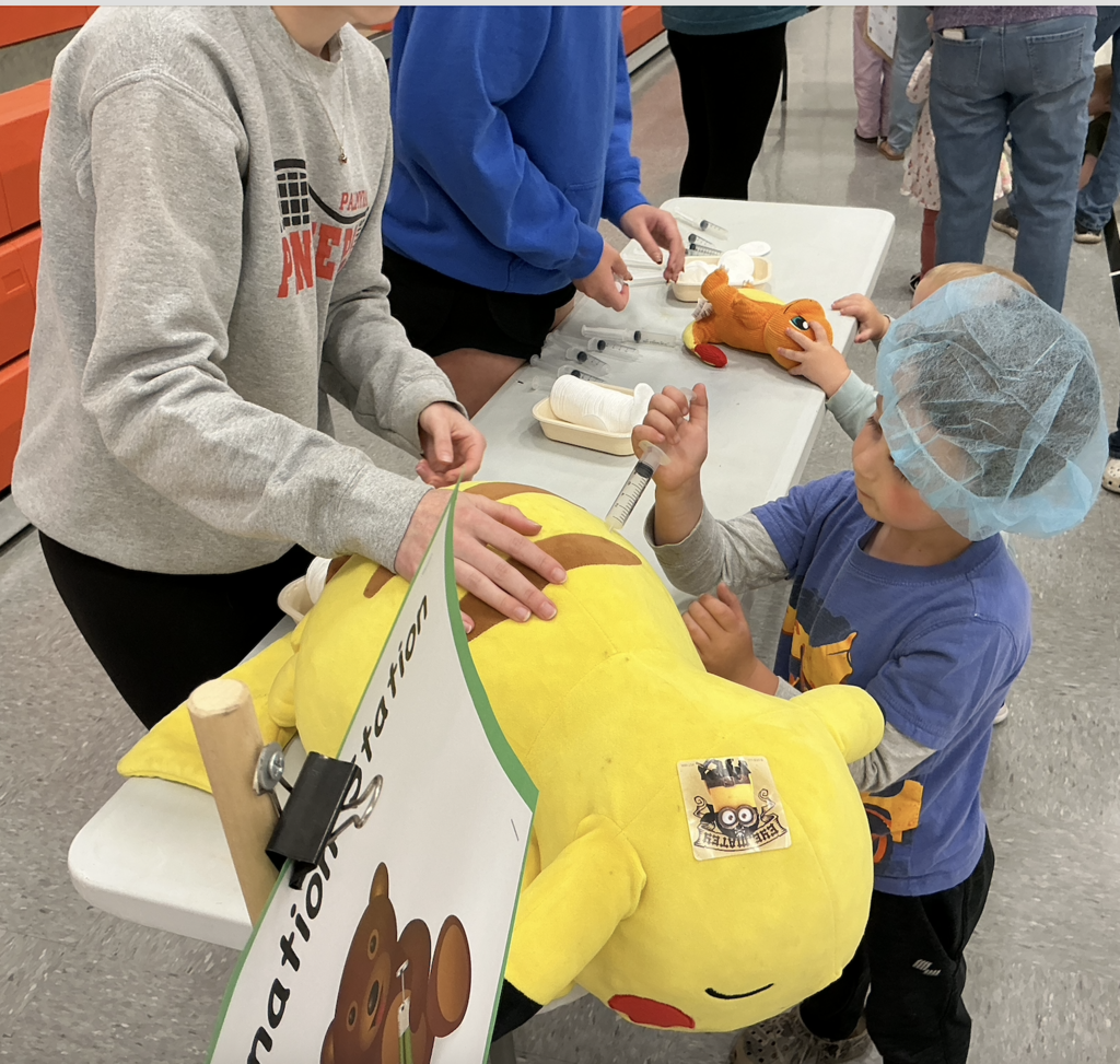 Students participating in PAT Teddy Bear Clinic