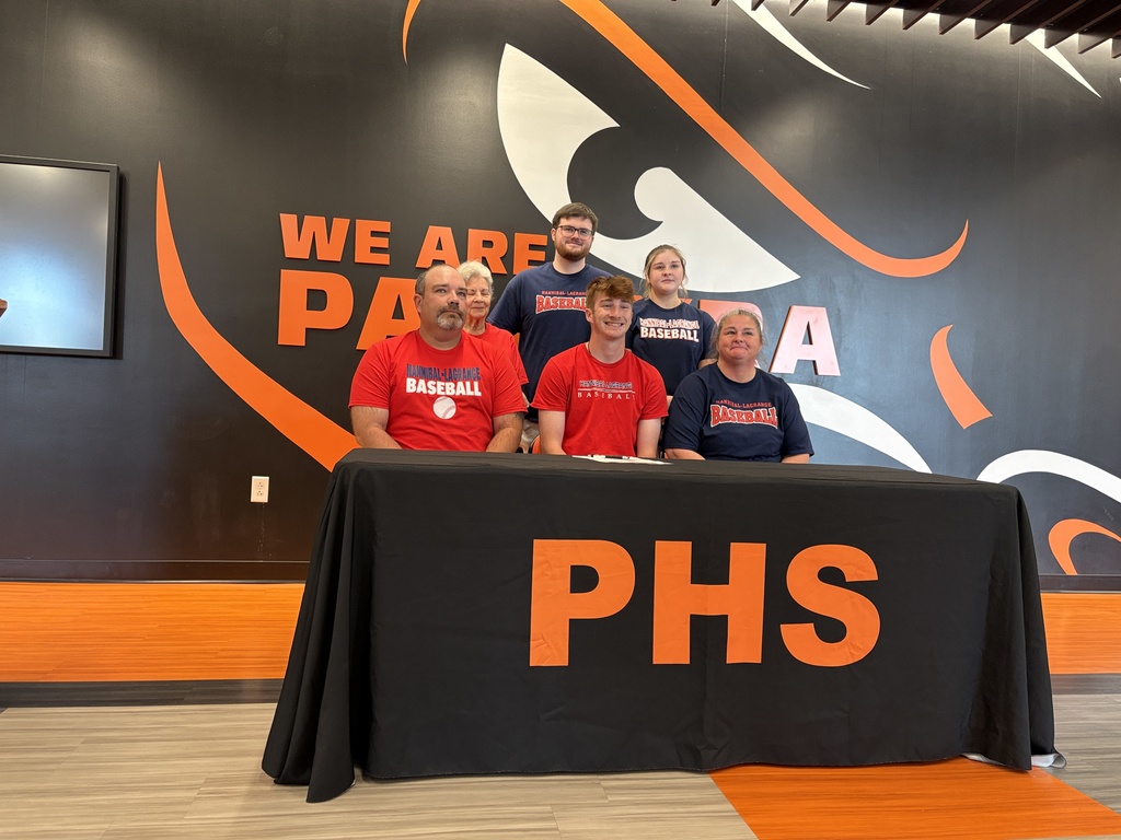 student with their families signing their NLI
