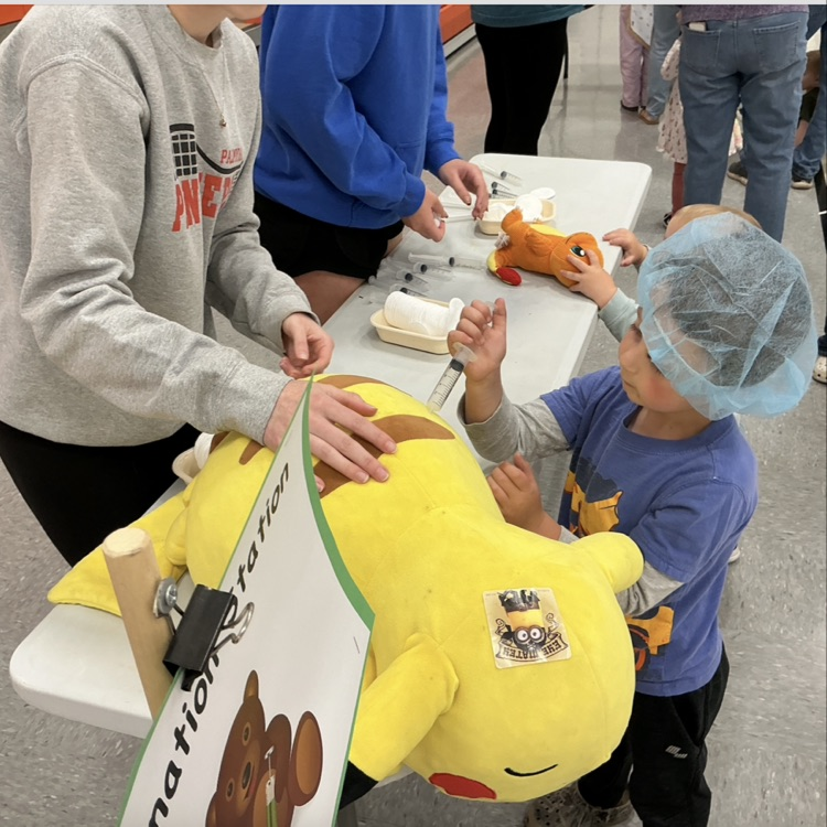 Students participating in PAT Teddy Bear Clinic