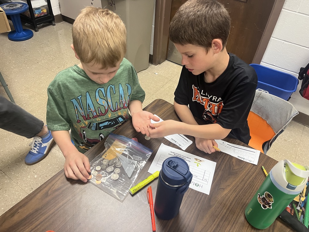 2nd grade students counting money and working with HOMEBANK to learning banking skills