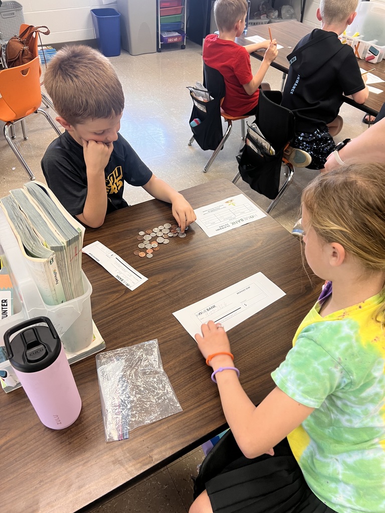 2nd grade students counting money and working with HOMEBANK to learning banking skills