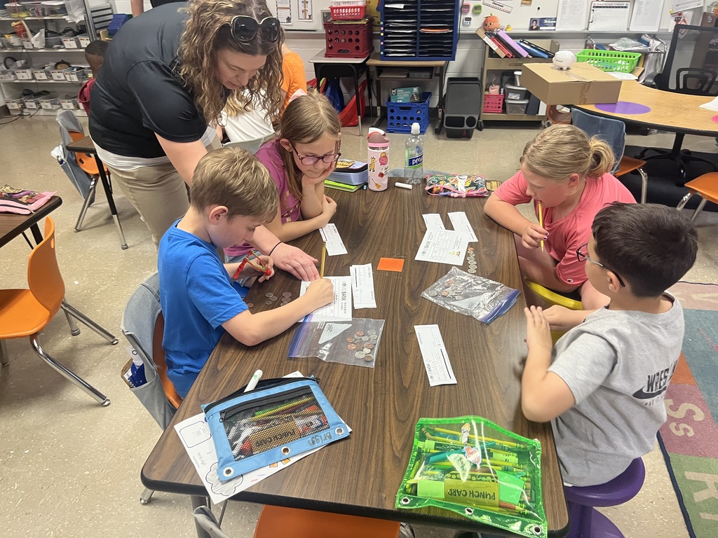 2nd grade students counting money and working with HOMEBANK to learning banking skills