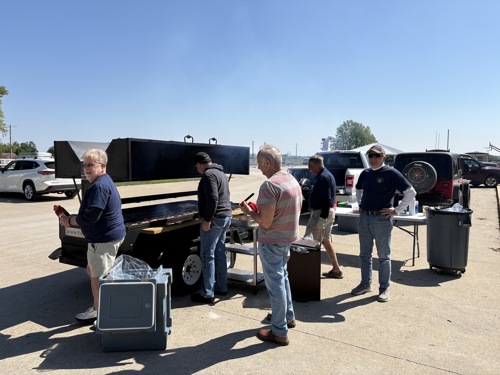Kiwanis members grilling pork chops