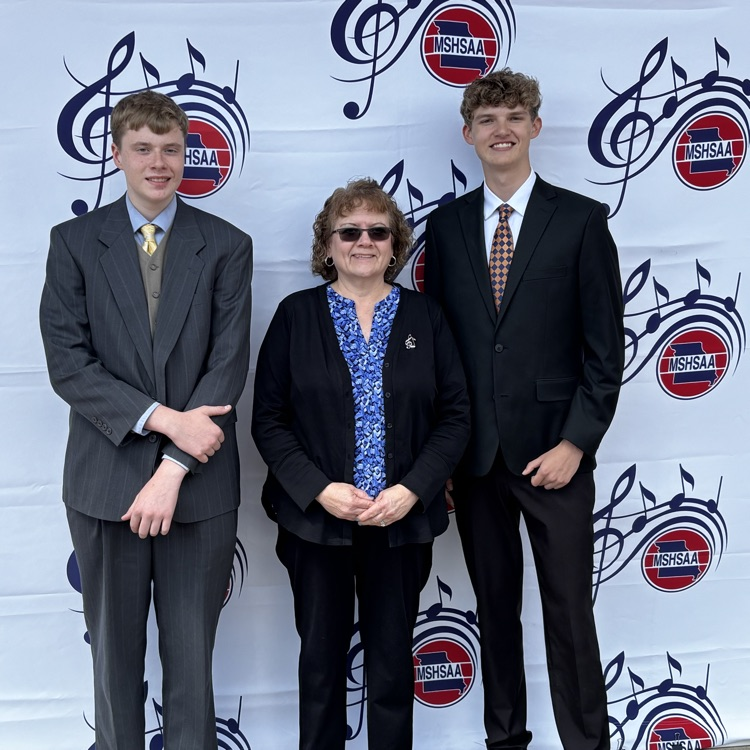 2 students with Mrs White at music festival 