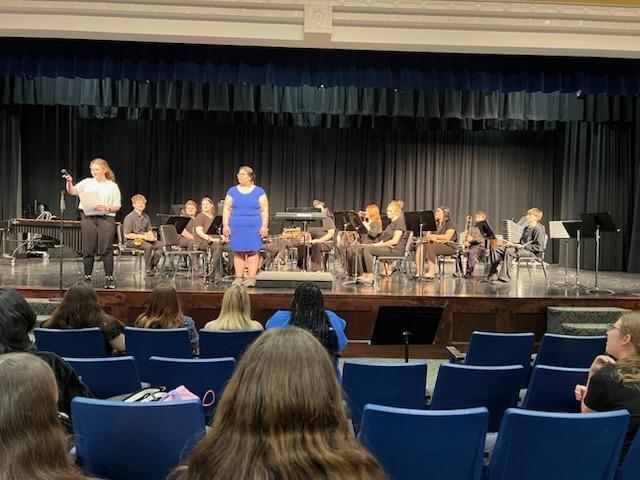 Band leader directing band concert