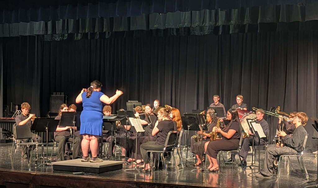 Band leader directing band concert