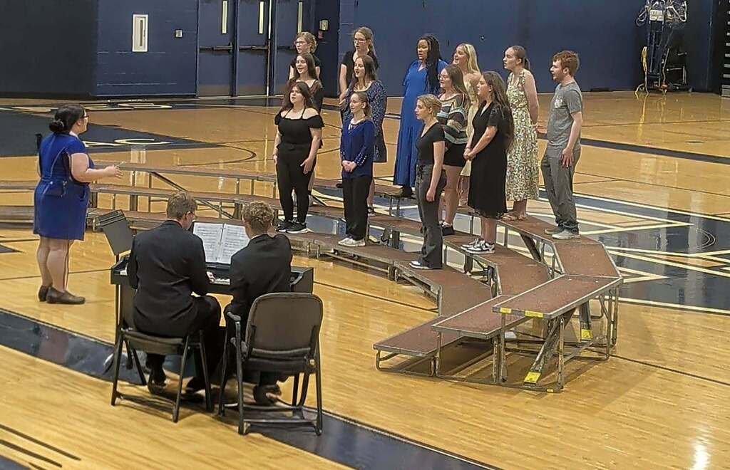 Band leader directing choir concert