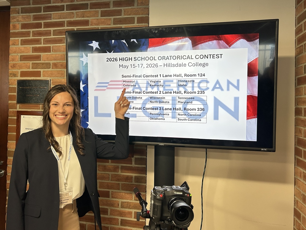 student stands in front of screen showing the states participating in her semifinal session of contest