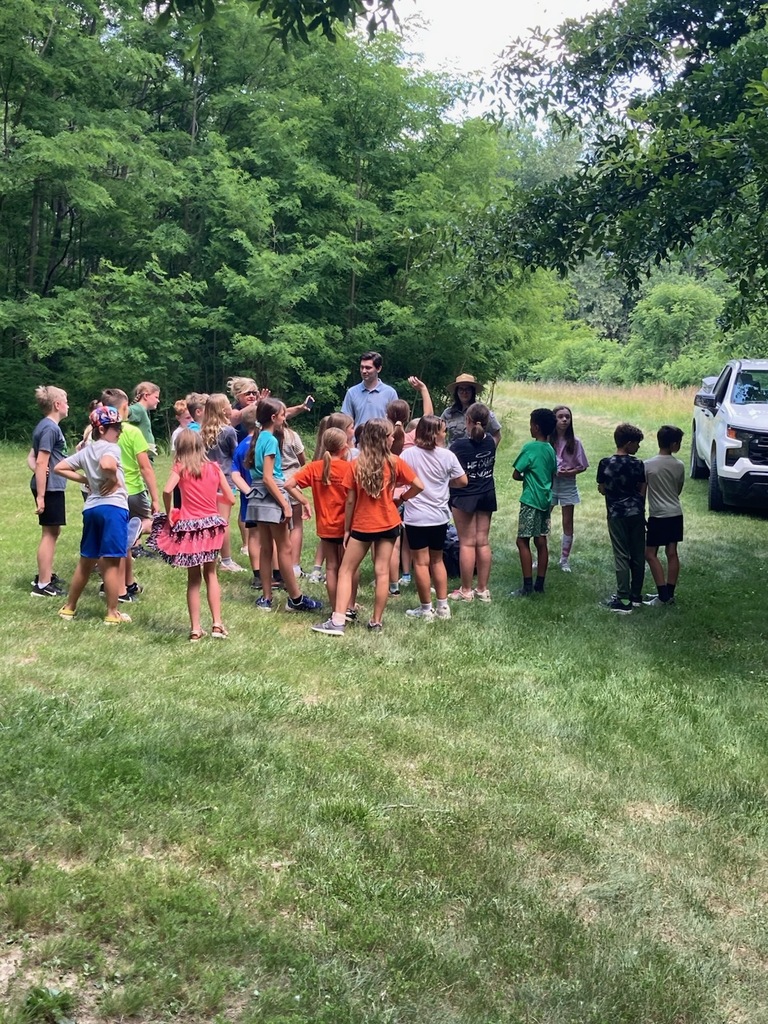 former 4th grade students meeting with WGEM news reporter to discuss the bat boxes at the park