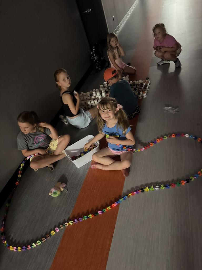 PES Students during summer school playing with beads