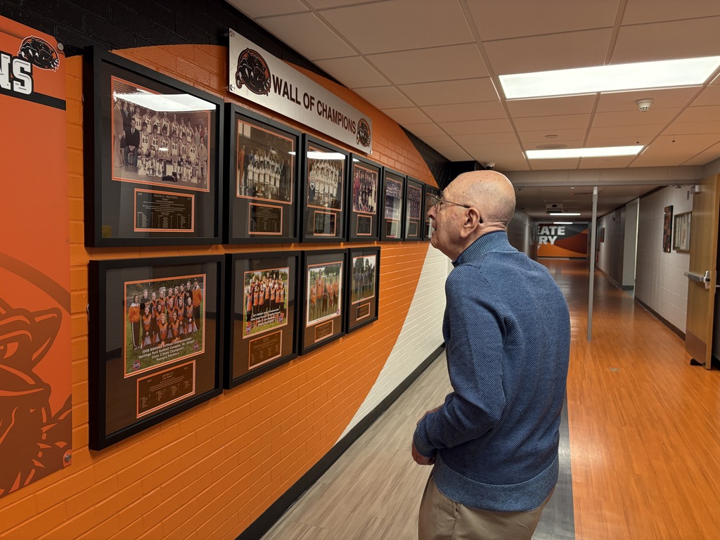 Mr Lenzini viewing Wall of Champions