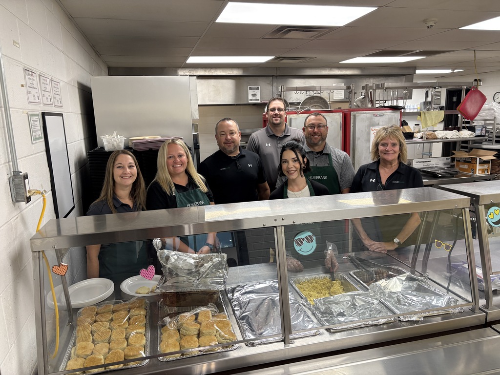 HOMEBANK staff serving breakfast to staff 