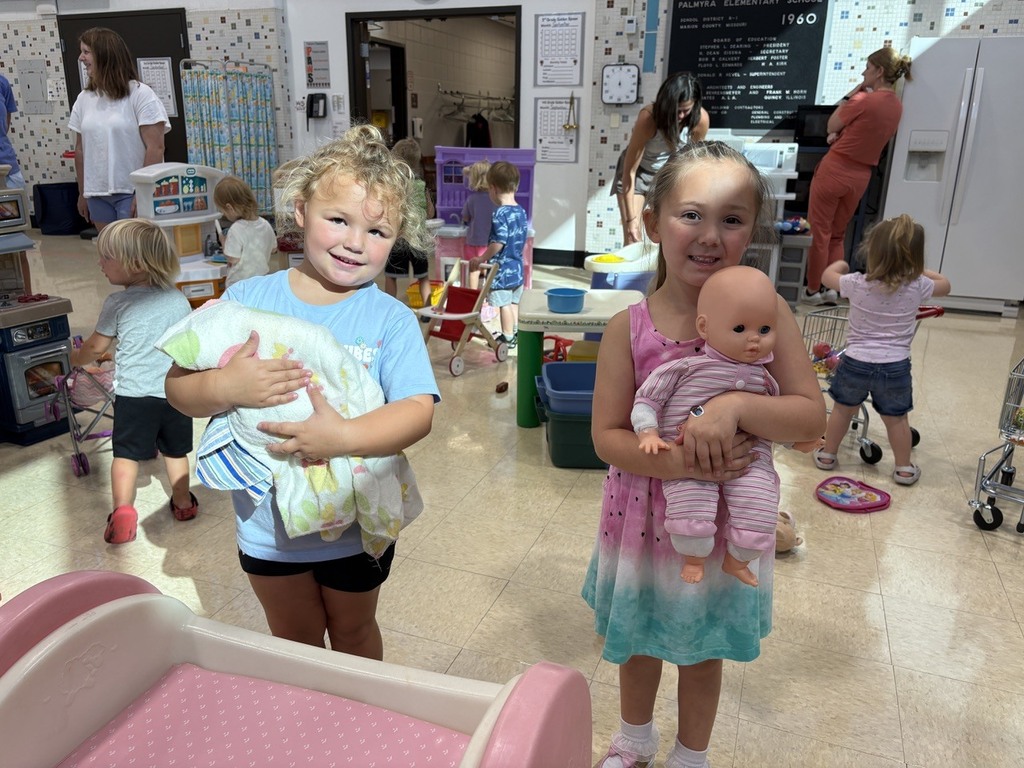 PAT playgroup participants taking care of babies