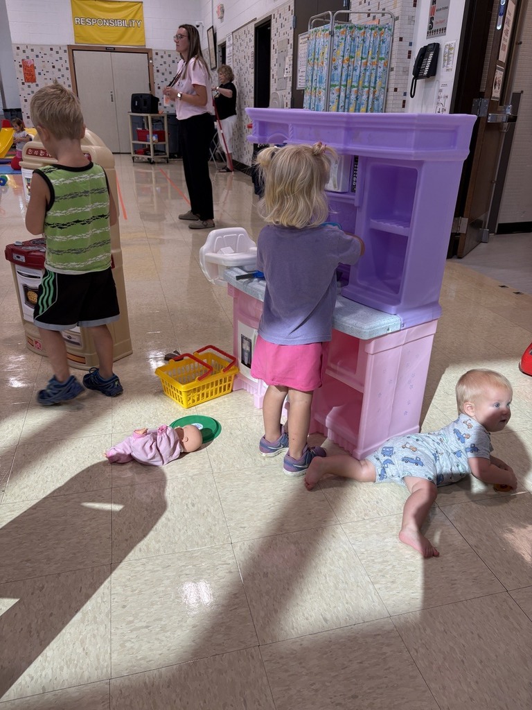 PAT playgroup participants playing with kitchen