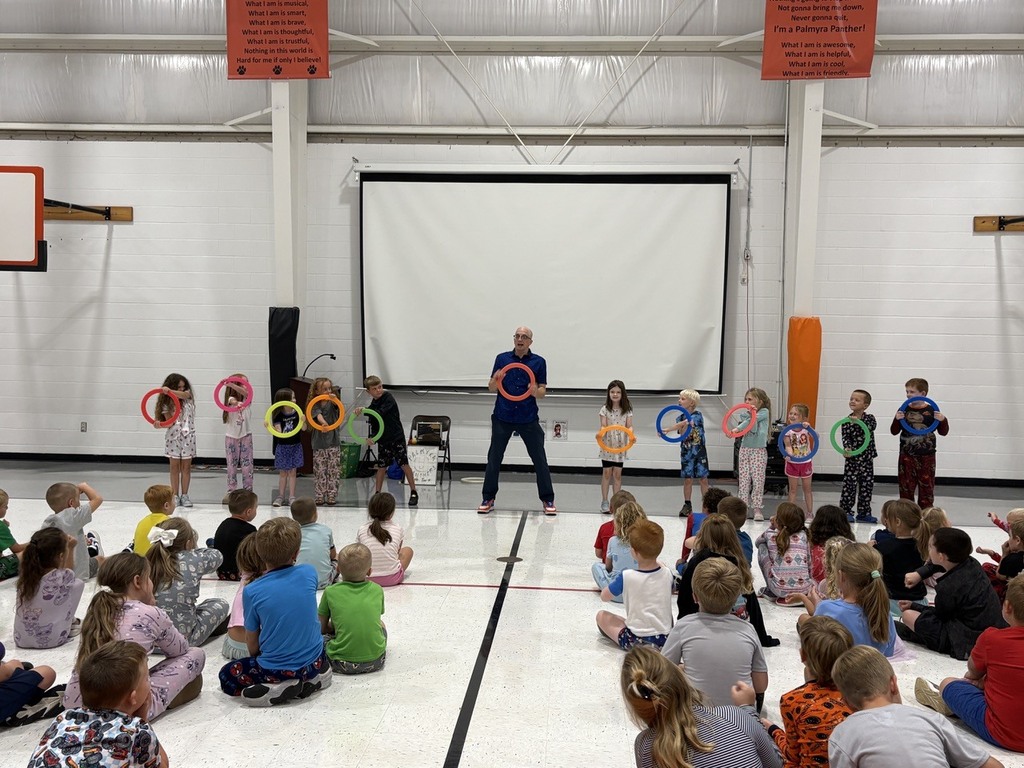 group of volunteer students with hoops during assembly