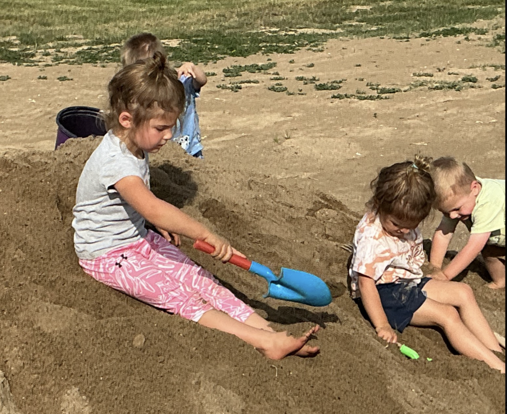 big dig kids in dirt and shovels
