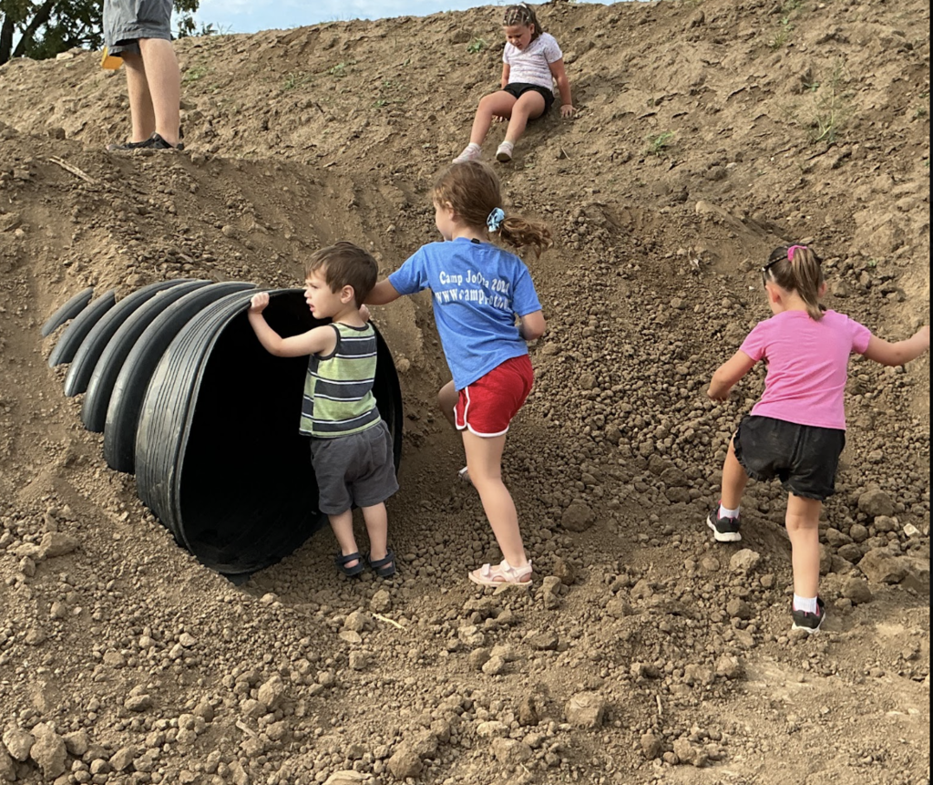 big dig kids in dirt and pipe