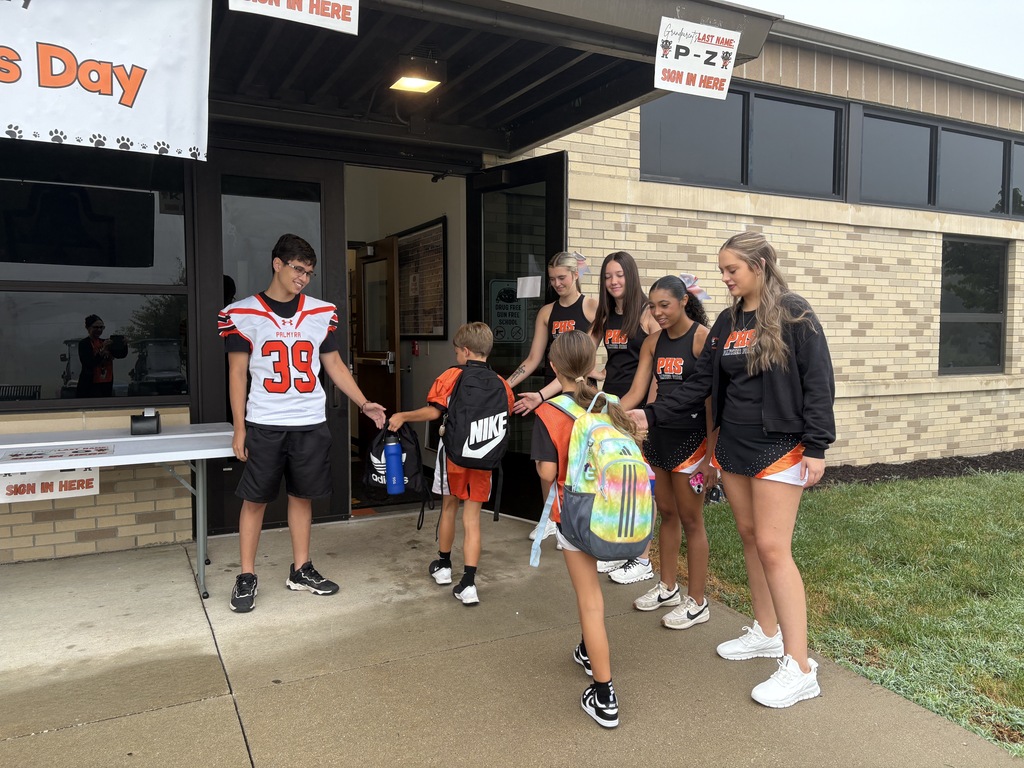PHS Students greeting PES morning arrivals