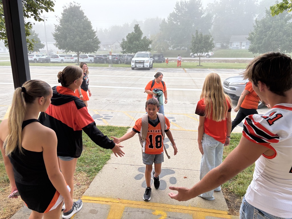 PHS Students greeting PES morning arrivals