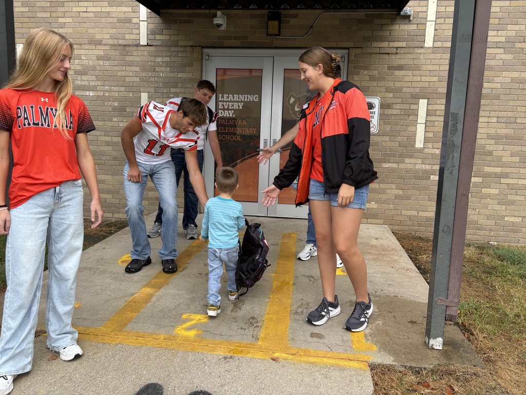 PHS Students greeting PES morning arrivals