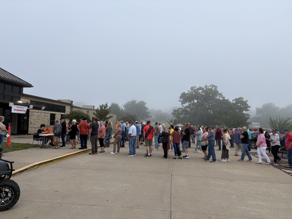 Grandparents lined up at registration tables