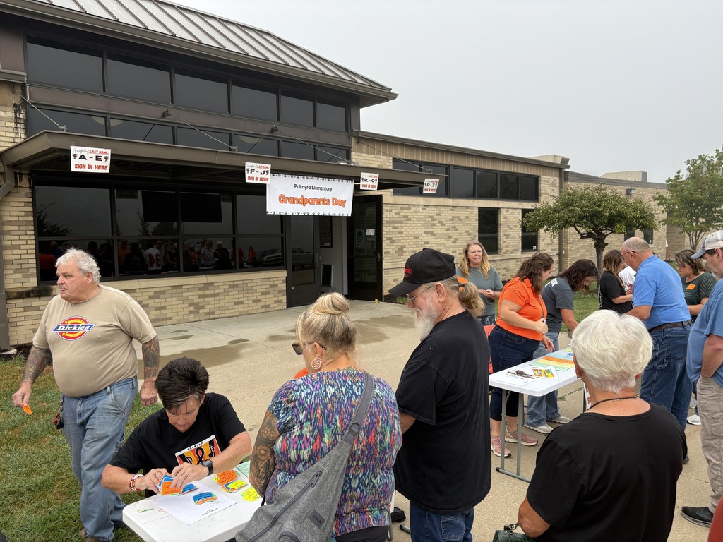 Grandparents lined up at registration tables