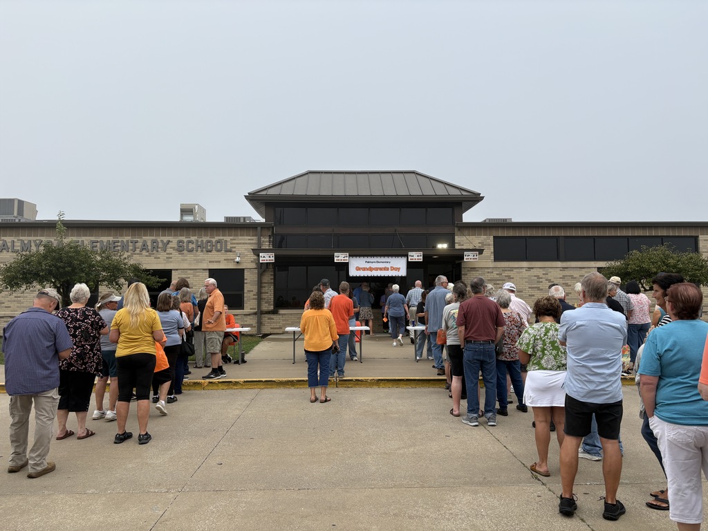 Grandparents lined up at registration tables