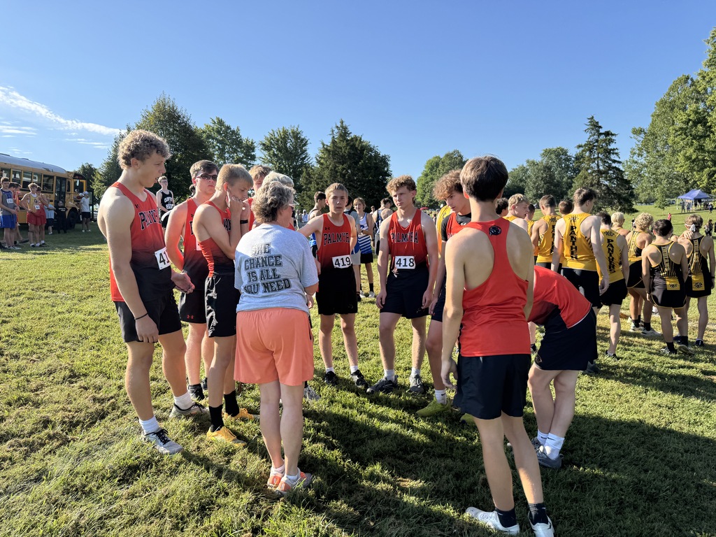coach with team before race
