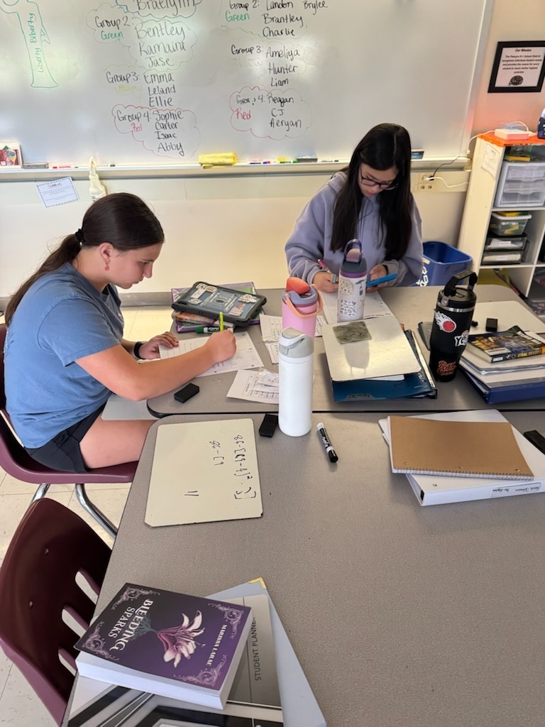 math students working on math lib in classroom