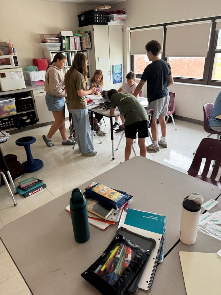 math students working on math lib in classroom