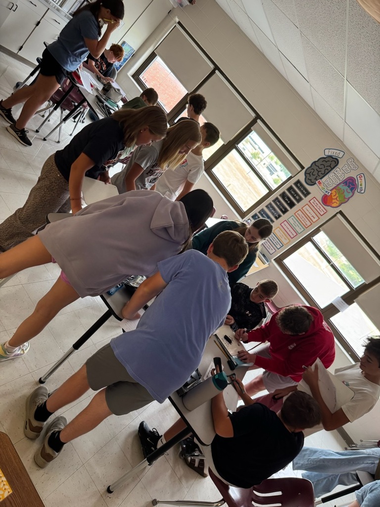 math students working on math lib in classroom