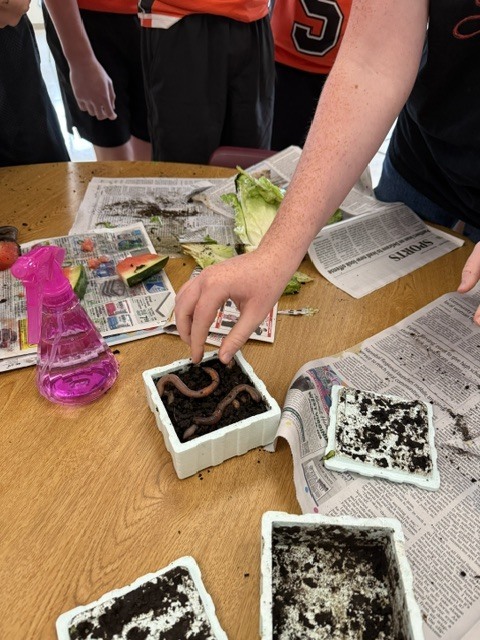 science students creating decomposition jars