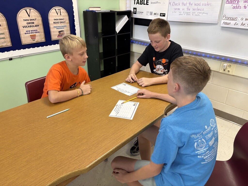 students playing dice game to work on math skills
