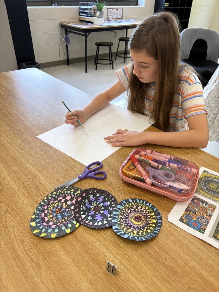 artist working on sunflower artwork poster