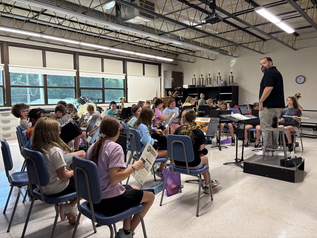 5th grade band students receiving their new instruments