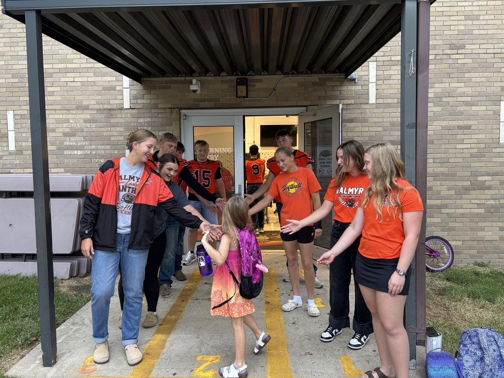 PHS Students greeting students at PES