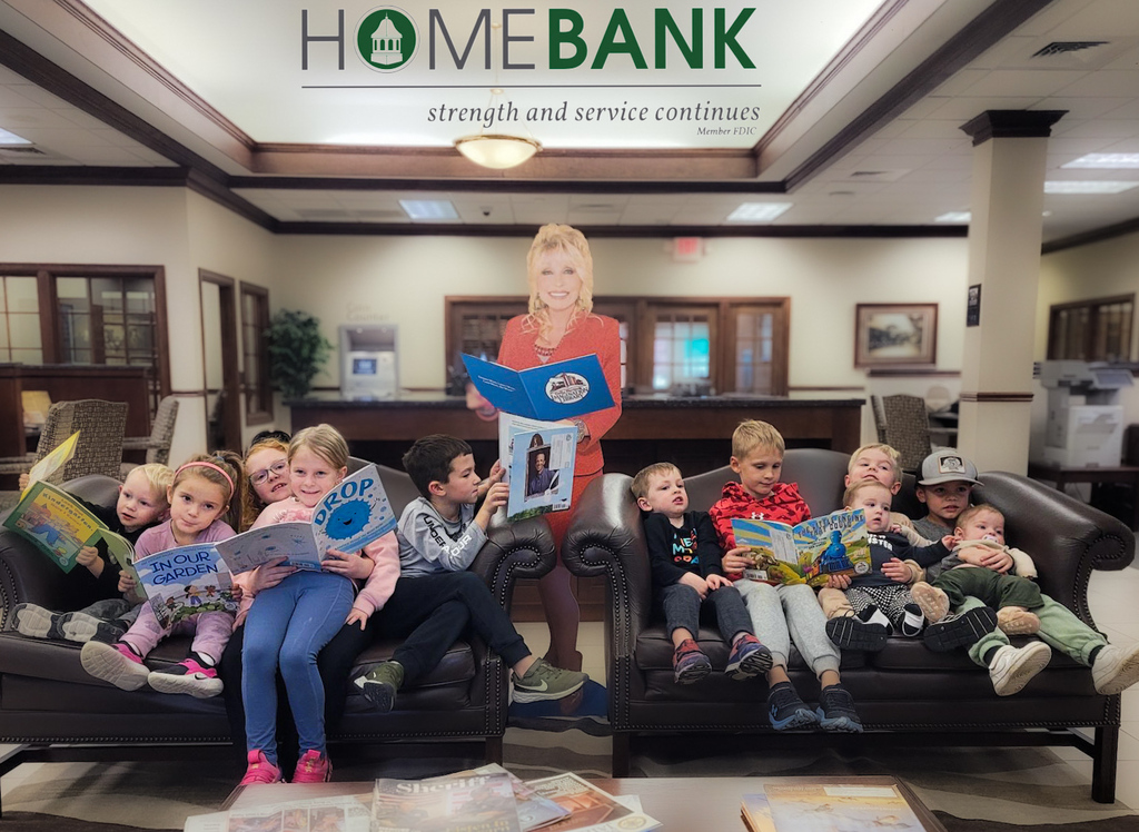 Dolly Parton cutout with children reading books