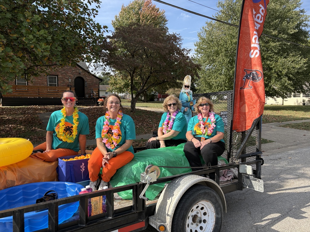 PAT staff members on homecoming float with Dolly Parton cutout
