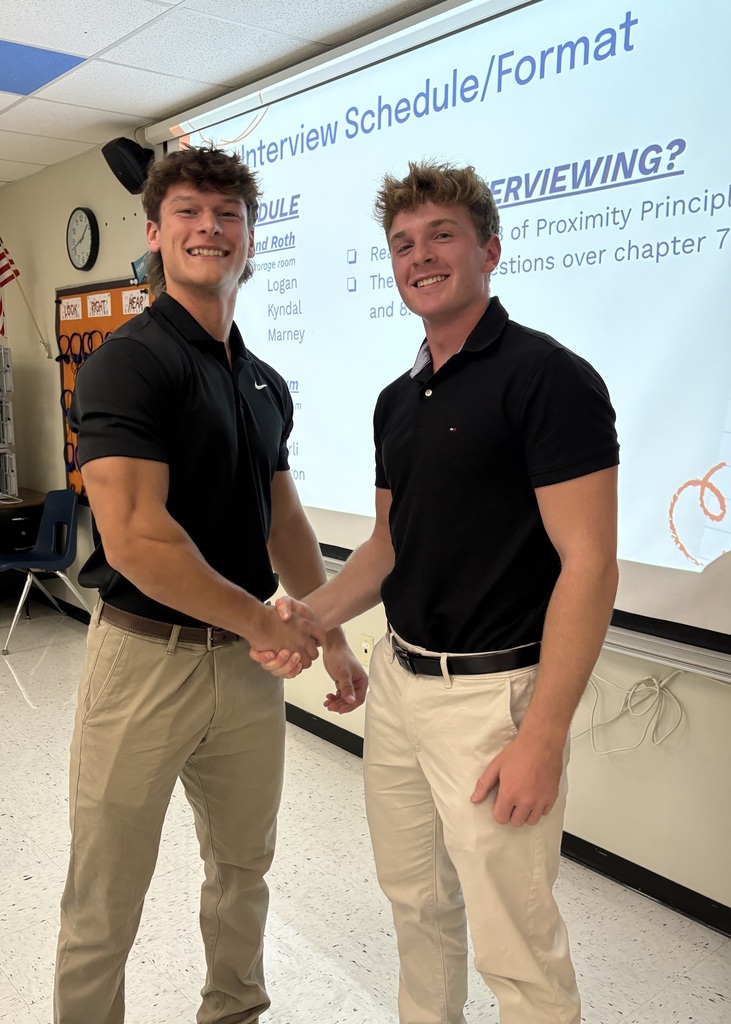 2 students posing before their mock interview