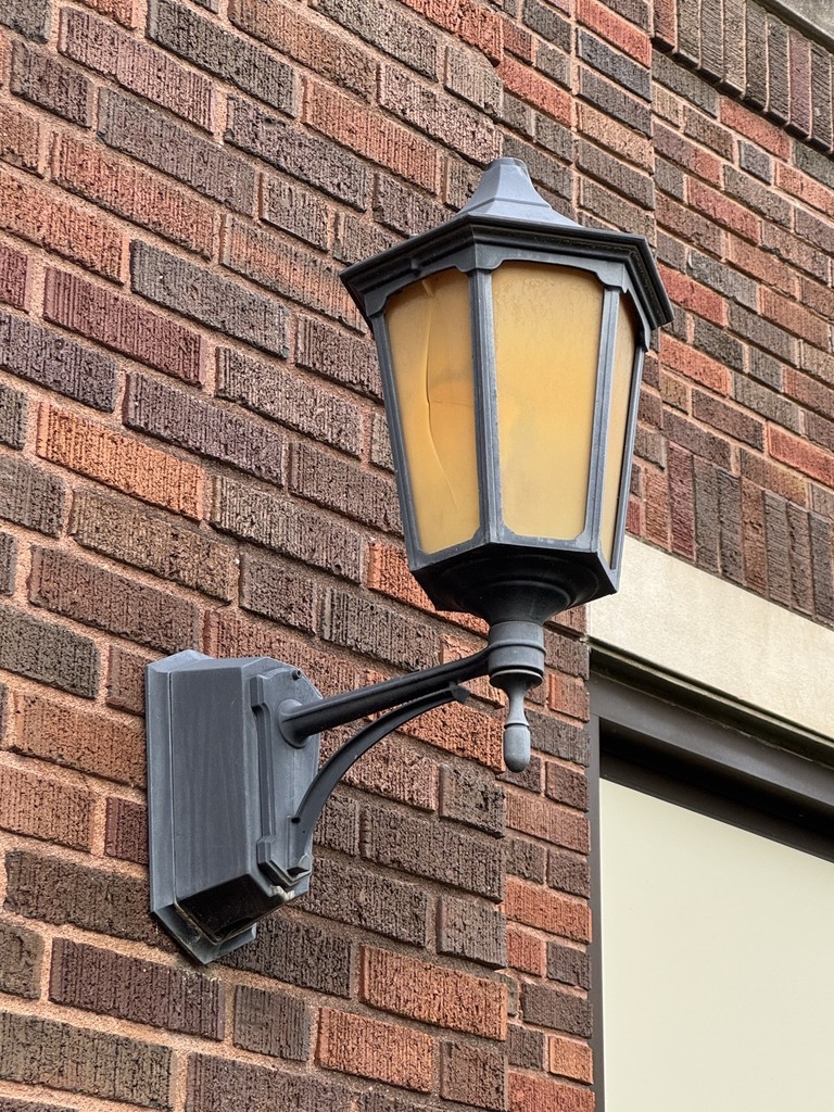black and yellow light fixture outside middle school