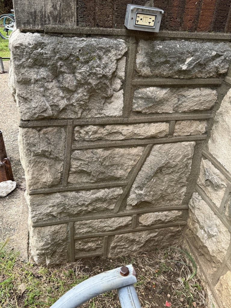 stones at corner of middle school wall