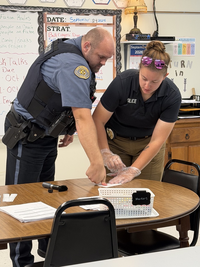 officers working on fingerprinting lesson