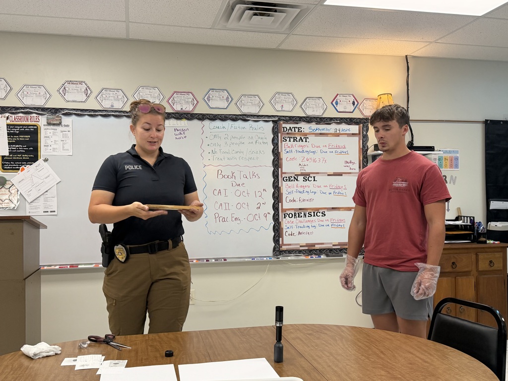 student and officer working on fingerprinting lesson