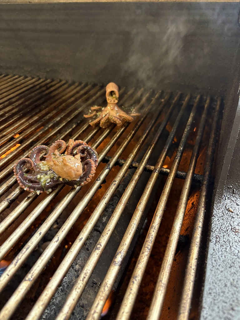 2 octopus on grill cooking