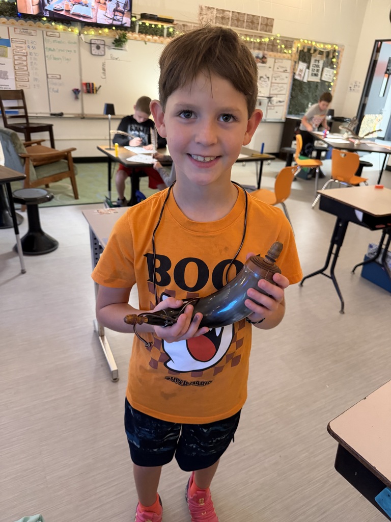 student exploring Lewis and Clark artifact